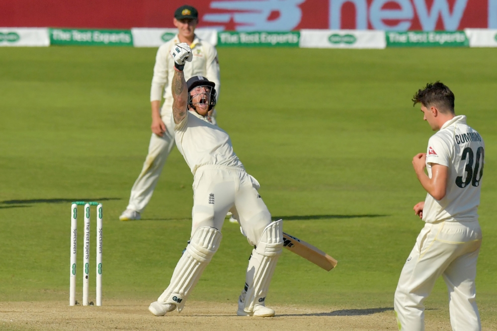 England's Ben Stokes celebrates hitting the winning runs on the fourth day of the third Ashes cricket Test match between England and Australia at Headingley in Leeds, northern England, on August 25, 2019. (AFP / Anthony Devlin)