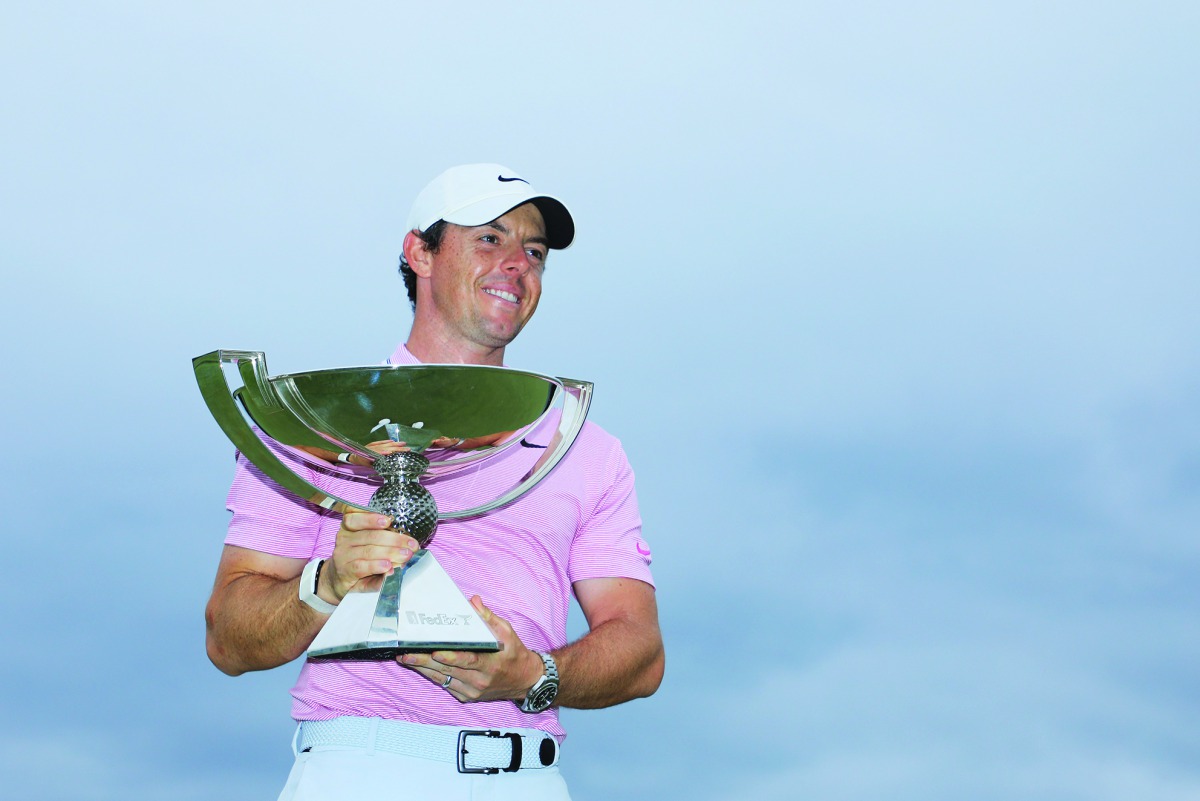 ory McIlroy of Northern Ireland celebrates with the FedExCup trophy after winning during the final round of the TOUR Championship at East Lake Golf Club on August 25, 2019 in Atlanta, Georgia. Sam Greenwood/Getty Images/AFP 