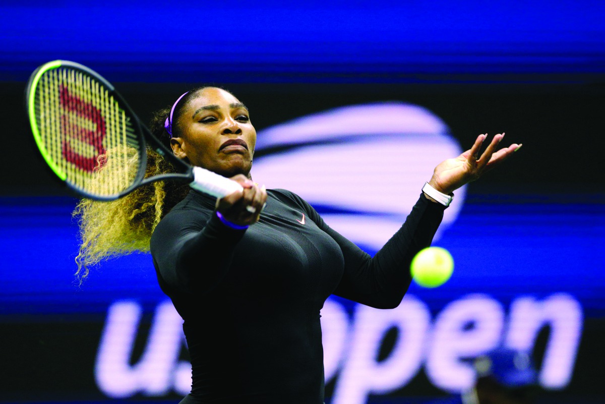 Serena Williams of the United Sates returns the ball to Maria Sharapova of Russia during their Round 1 women's Singles match at the 2019 US Open at the USTA Billie Jean King National Tennis Center in New York on August 26, 2019. AFP / Kena Betancur

