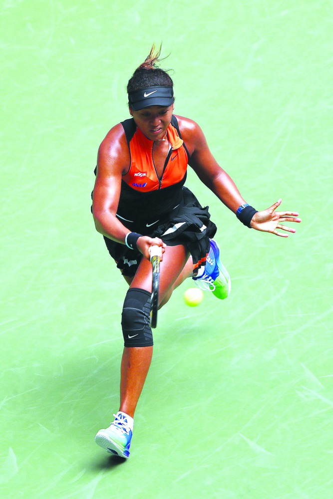  Naomi Osaka of Japan returns a shot against Anna Blinkova of Russia during their Women's Singles first round match on day two of the 2019 US Open at the USTA Billie Jean King National Tennis Center on August 27, 2019 in the Flushing neighborhood of the Q