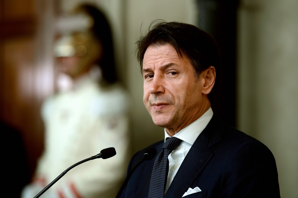 Italy’s Prime Minister Giuseppe Conte addresses the media following a meeting with the Italian president, after he was given a mandate to form a new government, on August 29, 2019 at the Quirinal presidential palace in Rome.  AFP / Filippo MONTEFORTE