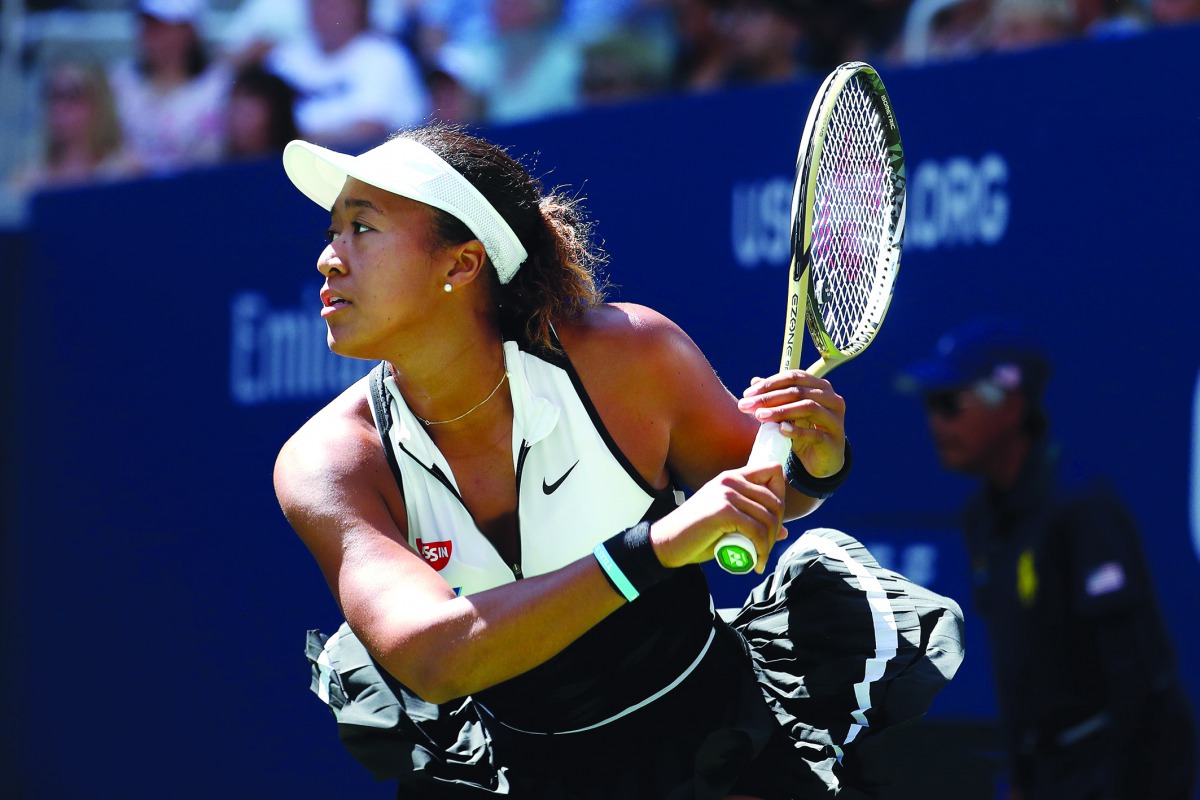 Naomi Osaka of Japan returns a shot during her Women's Singles second round match against Magda Linette of Poland on day four of the 2019 US Open at the USTA Billie Jean King National Tennis Center on August 29, 2019 in Queens borough of New York City. Al