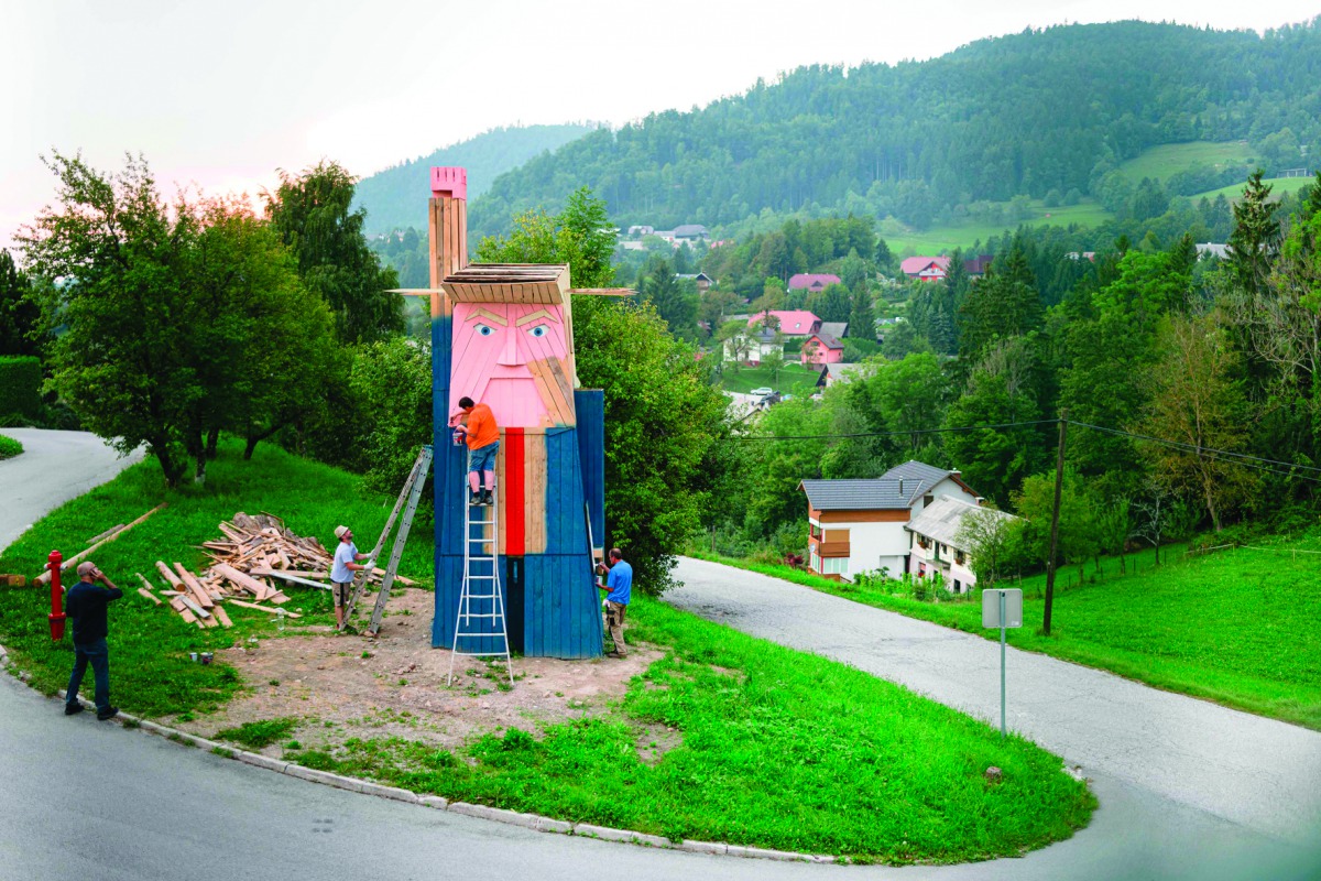 People work on a wooden statue, designed by local Slovenian artist Tomaz Schlegl, made to resemble  Donald Trump in the village of Sela pri Kamniku, about 20 miles northeast of Ljubljana in Slovenia, the home country of Trump's wife on August 28, 2019. AF