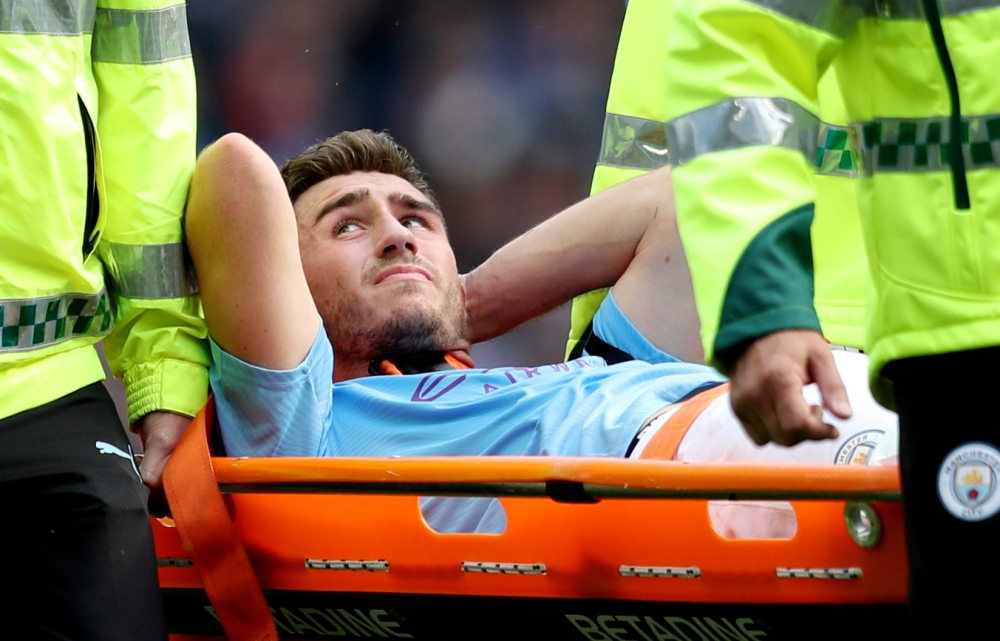 Manchester City's Aymeric Laporte is stretchered off after sustaining an injury REUTERS/Jon Super