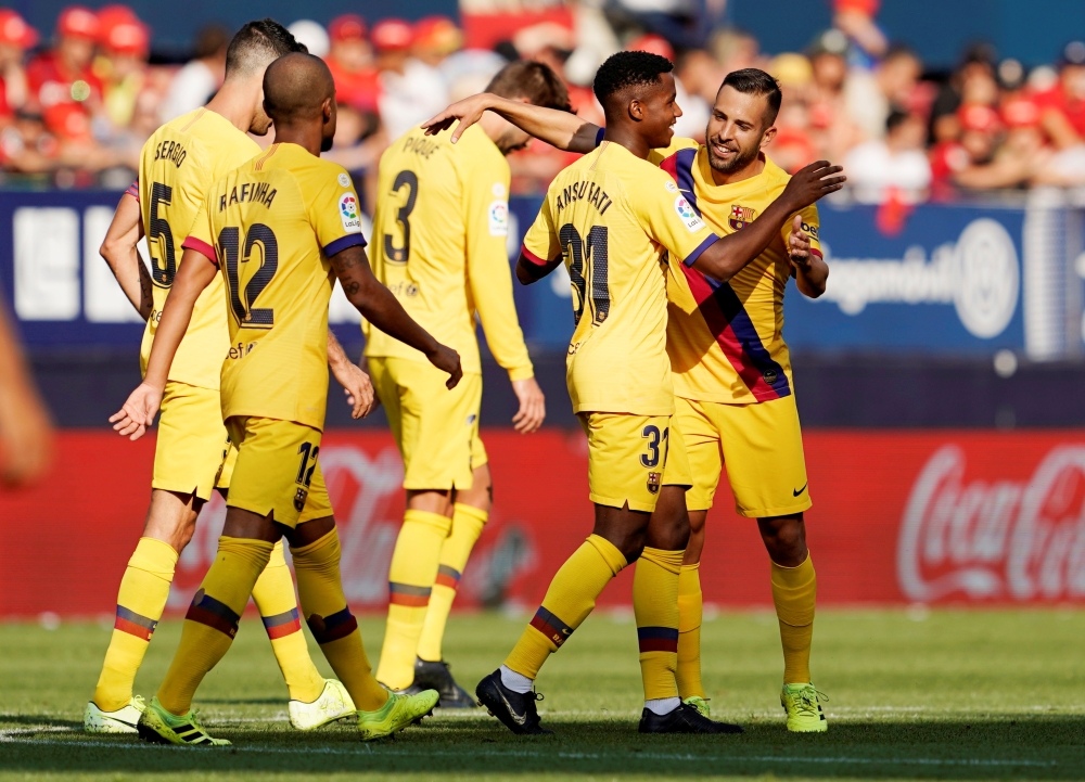 Barcelona's Anssumane Fati celebrates scoring their first goal with team mates REUTERS/Vincent West