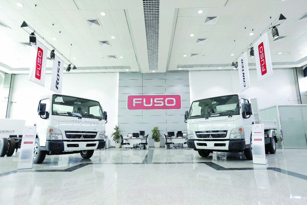 FUSO trucks on display in the showroom. 
