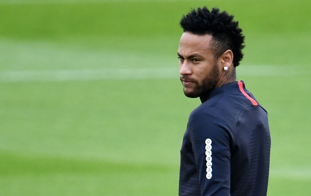 In this file photo taken on August 17, 2019, Paris Saint-Germain's Brazilian forward Neymar looks on as he takes part in a training session in Saint-Germain-en-Laye, west of Paris, on the eve of the French L1 football match between Paris Saint-Germain (PS