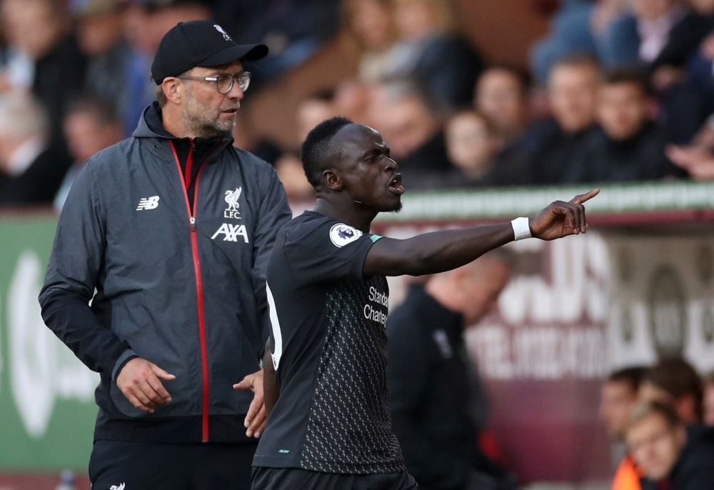 Liverpool's Sadio Mane reacts after being substituted off as manager Juergen Klopp looks on. Reuters/Carl Recine