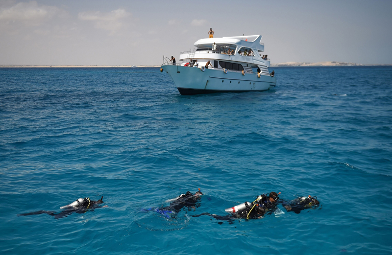 Divers swim off the coast of Red Sea resort of Hurghada  Egypt on April 4 2019 AFP Mohamed el-Shahed