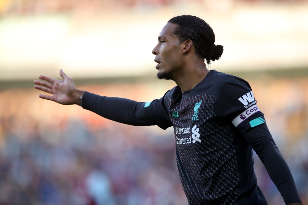 Liverpool's Virgil van Dijk gestures... Reuters/Carl Recine