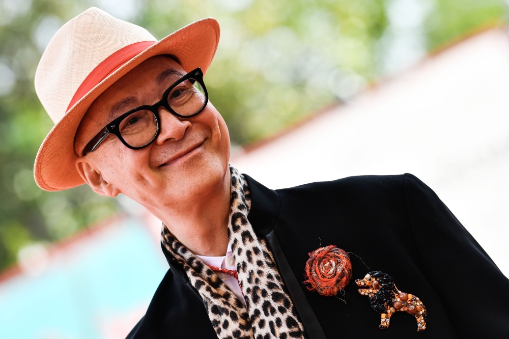 Chinese director Yonfan arrives for the screening of the animation film 