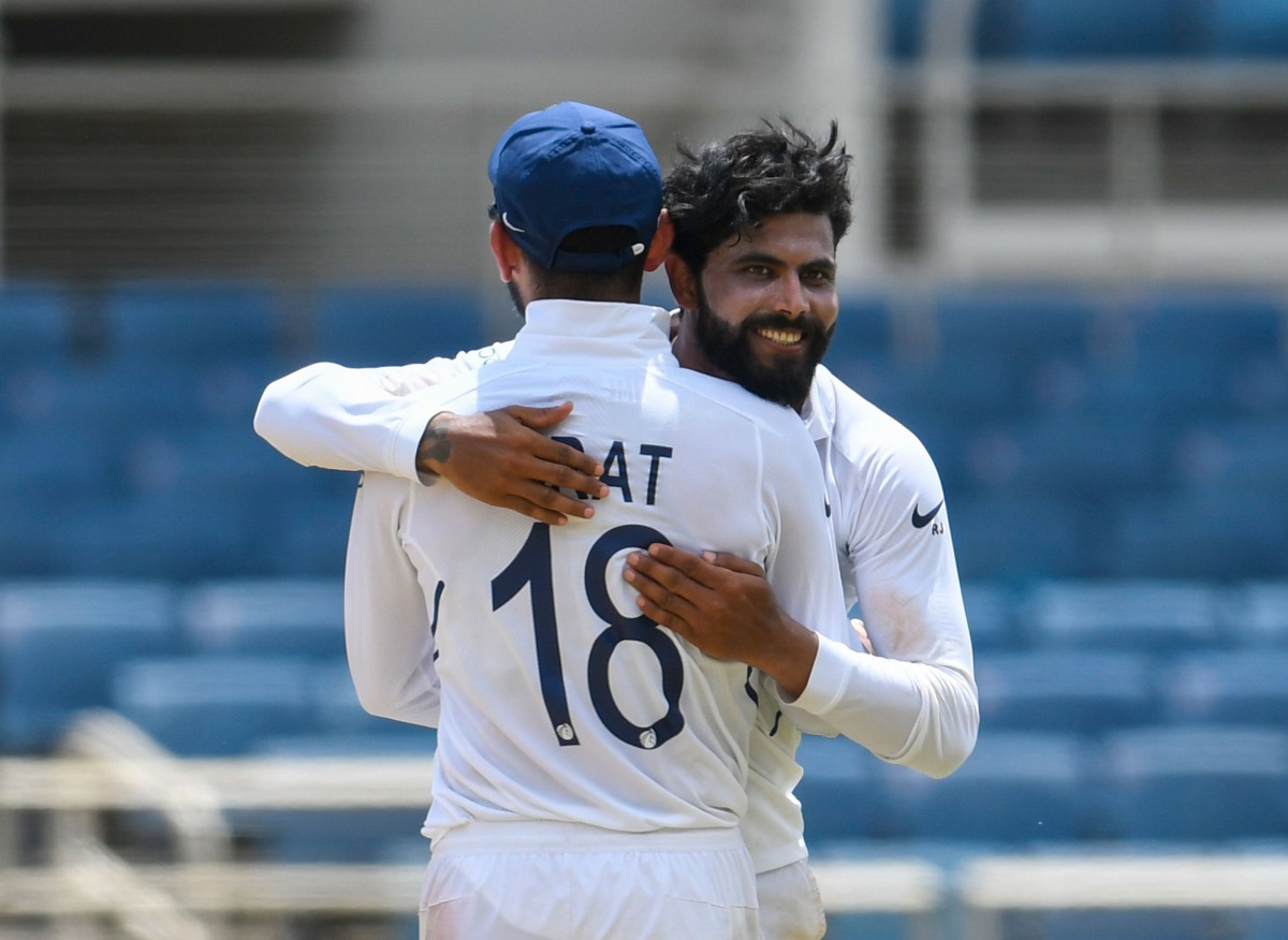 Virat Kohli (L) and Ravindra Jadeja (R) of India hug in celebration of Jahmar Hamilton of West Indies dismissal during day 4 of the 2nd Test between West Indies and India at Sabina Park, Kingston, Jamaica, on September 2, 2019. AFP / Randy Brooks

