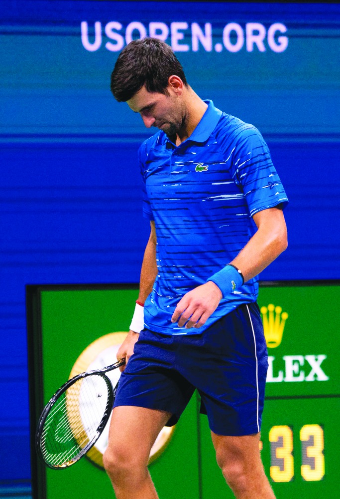 Novak Djokovic of Serbia hangs his head while playing Stan Wawrinka of Switzerland during their Round Four Men's Singles match at the 2019 US Open at the USTA Billie Jean King National Tennis Center in New York on September 1, 2019. AFP / Don Emmert