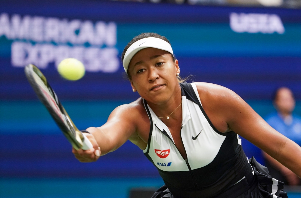Naomi Osaka of Japan returns a shot against Belinda Bencic of Switzerland during their Round Four Women's Singles match at the 2019 US Open at the USTA Billie Jean King National Tennis Center in New York on September 2, 2019. / AFP / Kena Betancur 