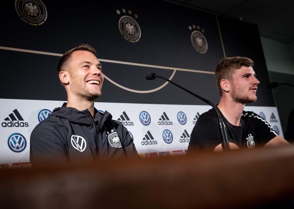 Germany's goalkeeper Manuel Neuer (L) and Germany's forward Timo Werner attend a press confeence ahead of the Euro 2020 football qualification match between Germany and Netherlands in Hamburg on September 3, 2019.  AFP / Christian Charisius
