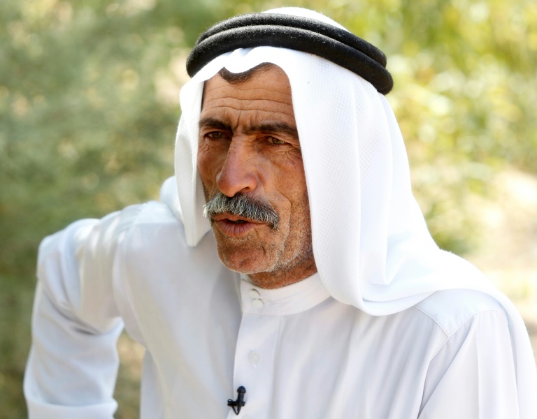 Abu Bashir, a local official who lost two sons to improvised explosive devices in the Al-Nour district outside Iraq's Baiji, an oil-rich region ravaged by fighting against the Islamic State group in 2014 (AFP /Sabah Arar)