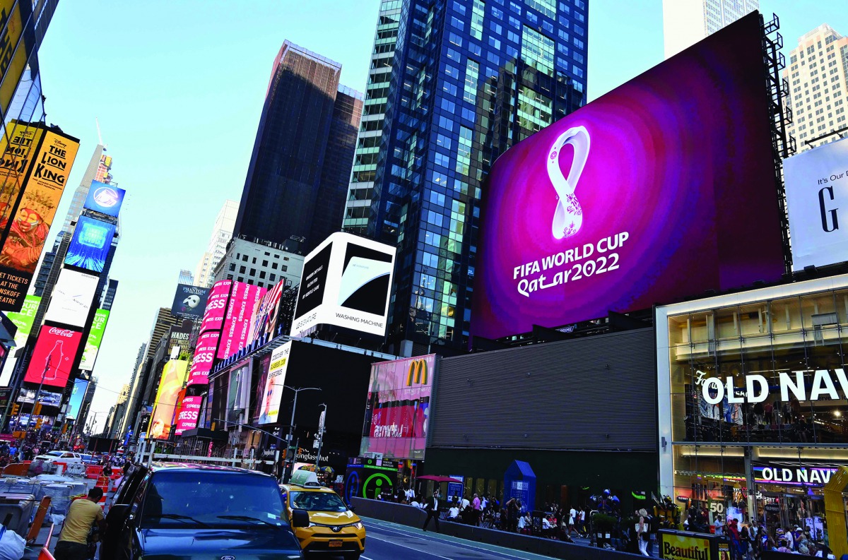 The official 2022 FIFA World Cup Qatar emblem flashes on an electronic billboard at Time Square in New York City on Tuesday