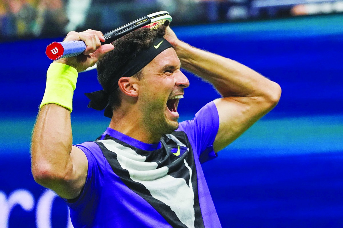 Grigor Dimitrov of Bulgaria reacts to his win against Roger Federer of Switzerland in their Men's Singles Quarter-finals tennis match during the 2019 US Open at the USTA Billie Jean King National Tennis Center in New York on September 3, 2019. AFP / Domin