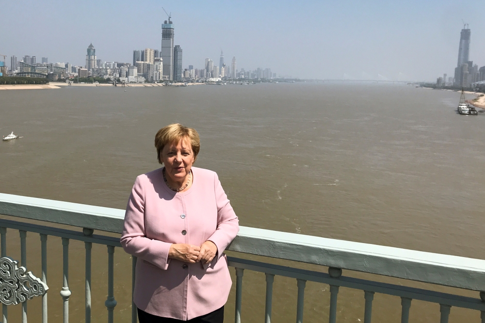German Chancellor Angela Merkel poses for pictures on a bridge crossing the Yangtze River in Wuhan, China September 7, 2019. REUTERS/Andreas Rinke