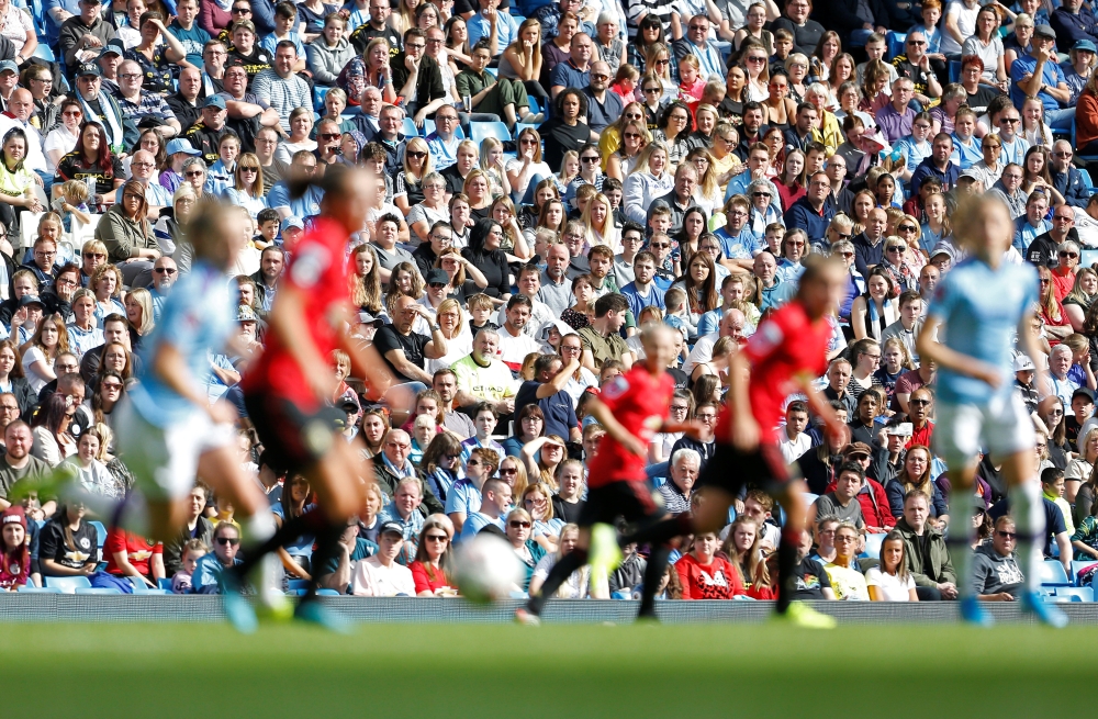 Fans watch the match Action Images via Reuters/Craig Brough