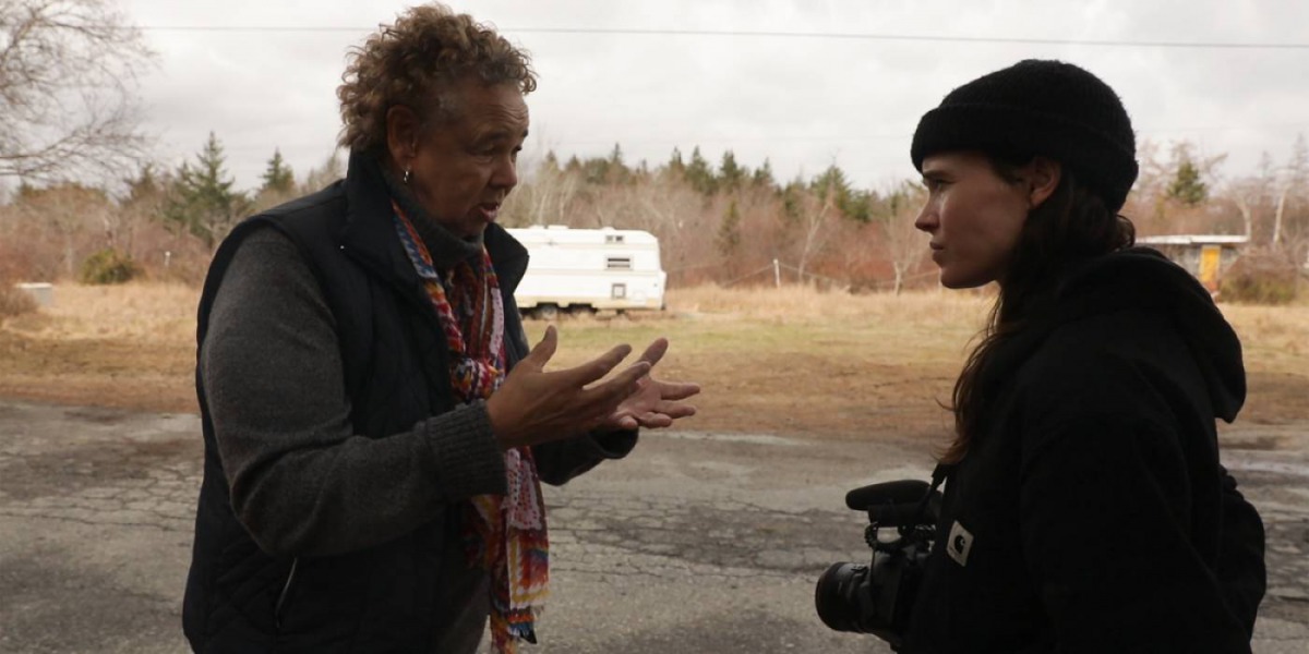 Actress Ellen Page speaks to an activist in Nova Scotia province, Canada, in “There’s Something in the Water”, her first film as a director. Photo courtesy of TIFF