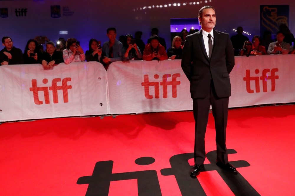 Joaquin Phoenix poses at the premiere of 