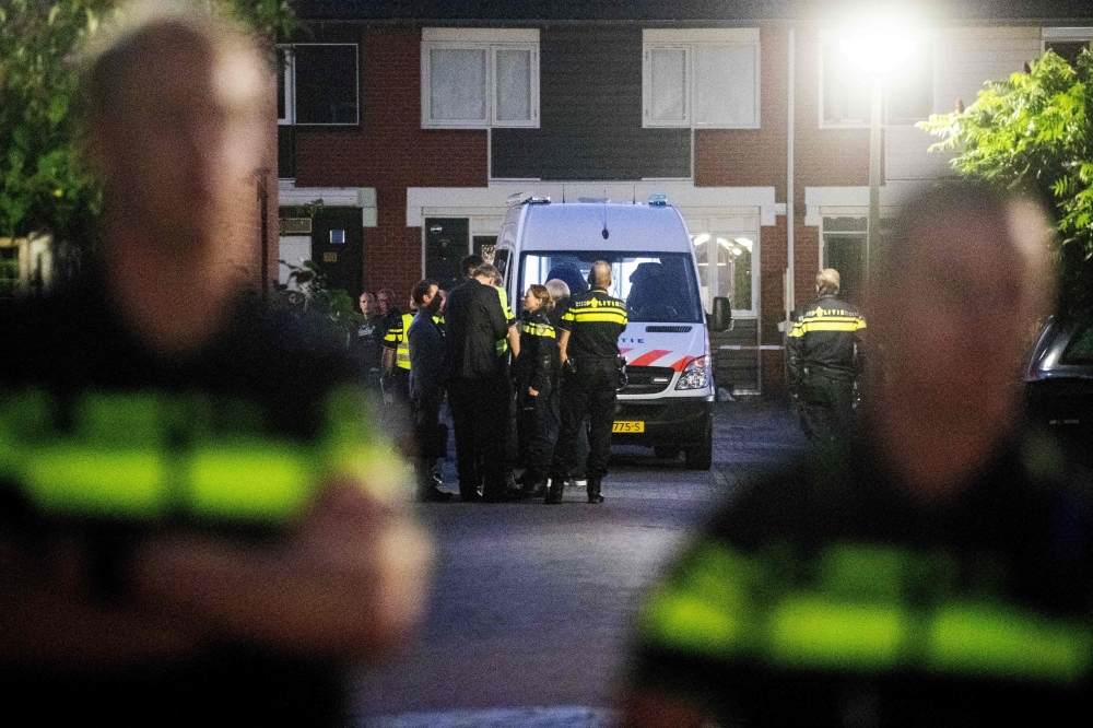 Police stand after a shooting incident in which several victims were killed, on the Heimerstein in Dordrecht, on September 9, 2019. - Netherlands OUT / AFP / ANP / Niels Wenstedt