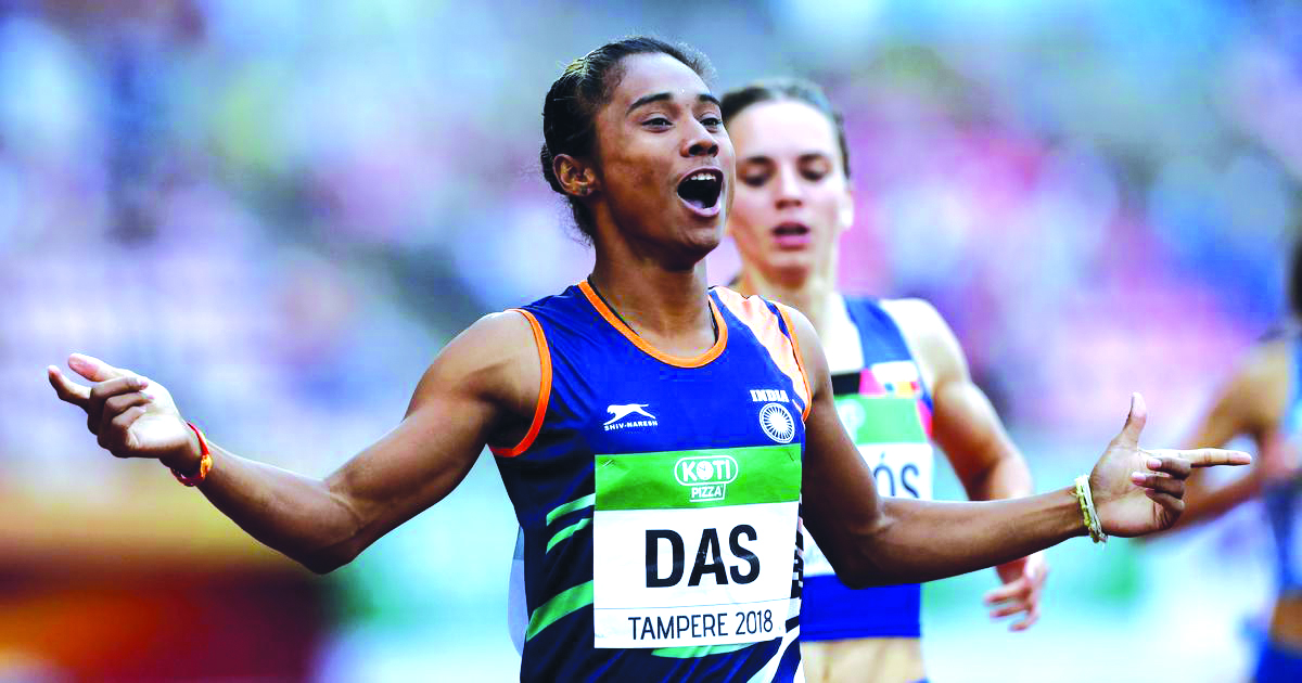 Hima Das of India celebrates winning a race in this file picture.
