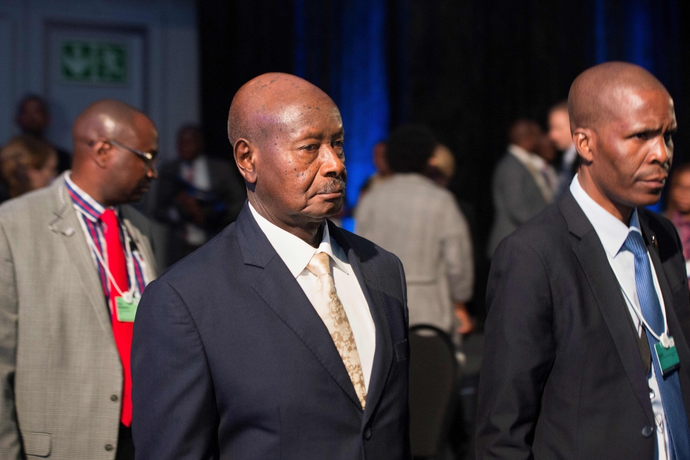 File photo of Uganda's President Yoweri Museveni (C) arrives to attend the World Economic Forum (WEF) Africa meeting at the Cape Town International Convention Centre, on September 5, 2019, in Cape Town. / AFP / RODGER BOSCH 
