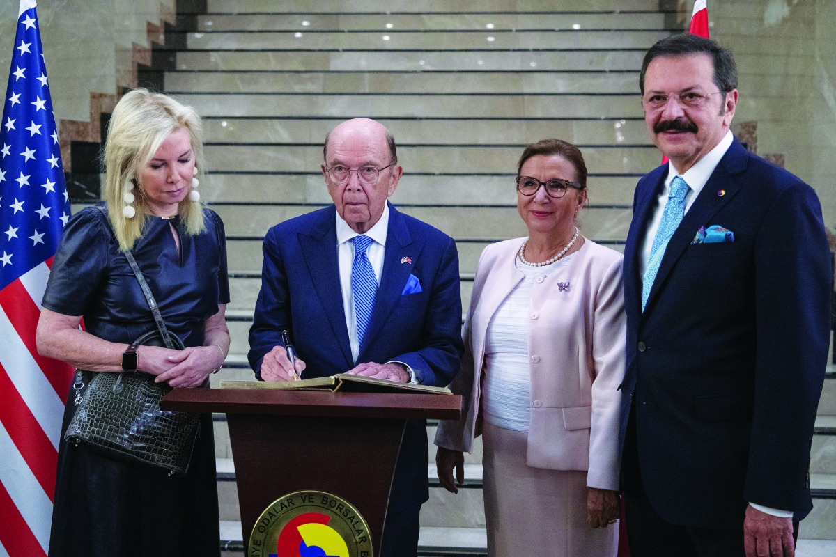 United States Secretary of Commerce Wilbur Ross (2nd L), accompanied by Turkish Trade Minister Ruhsar Pekcan (2nd R), TOBB Chairman Rifat Hisarciklioglu (R), signs TOBB's guestbook during a working lunch held by Turkey -US Businesspeople in Ankara, Turkey