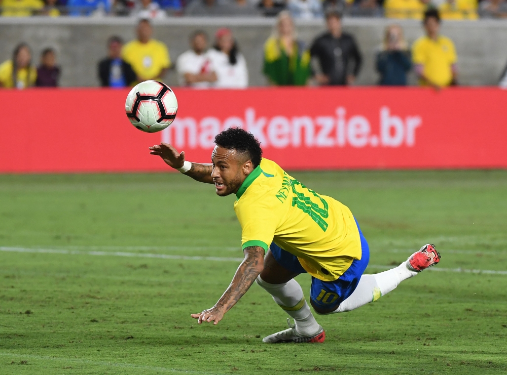 Neymar of Brazil stumbles during the International Friendly football match between Brazil and Peru at the Los Angeles Memorial Coliseum, in Los Angeles, California on September 10, 2019. Peru went on to win 1-0. / AFP / Mark RALSTON