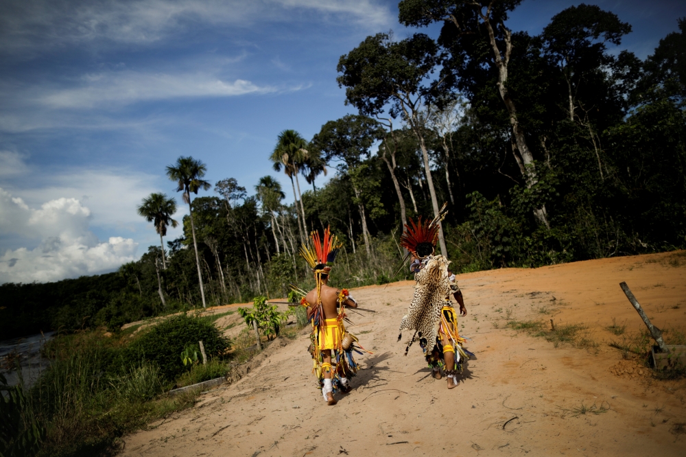 Indigenous people of the Pareci community walk in the village of Wazare near the town of Campo, Novo do Parecis, Brazil, April 26, 2018. Reuters / Ueslei Marcelino