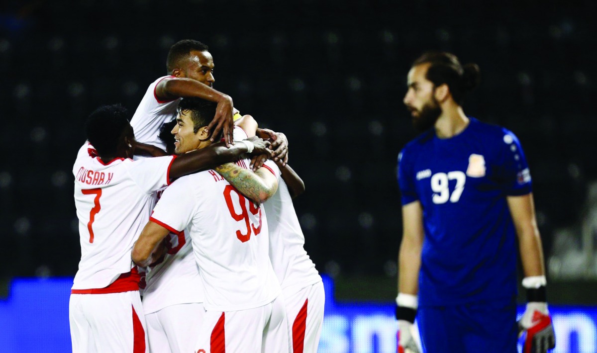 Al Arabi players celebrate after scoring one of their five goals against Umm Salal duing their QNB Stars League match played at the Al Janoub Stadium, yesterday.