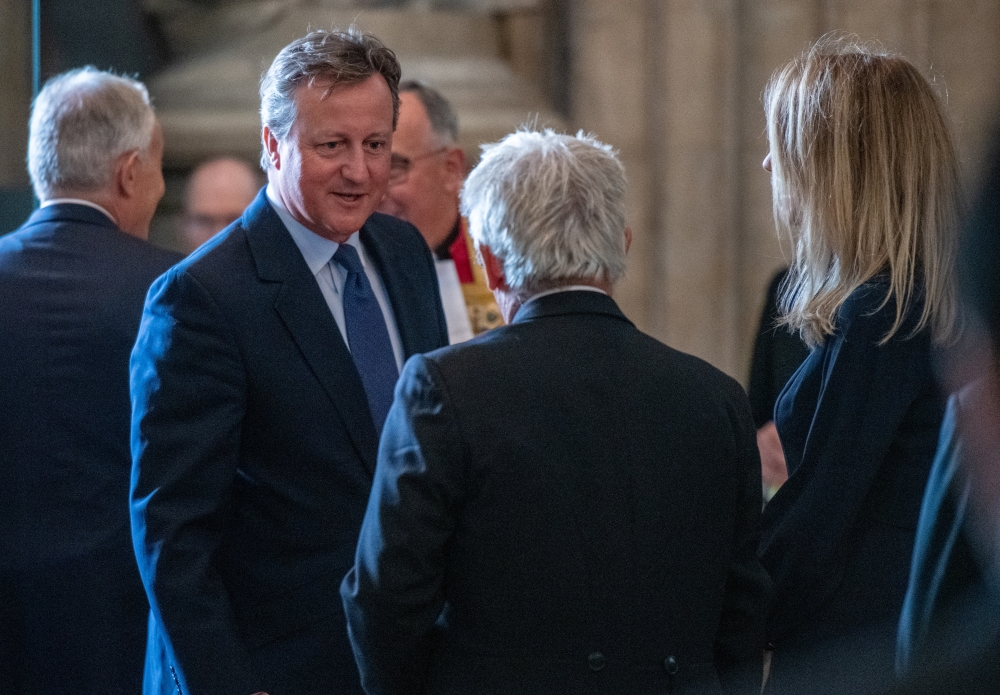 FILE PHOTO: Britain's former Prime Minister David Cameron speaks with Speaker of the House of Commons, John Bercow during the memorial service for Lord Paddy Ashdown at Westminster Abbey, in London, Britain September 10, 2019. Chris J Ratcliffe/Pool via R