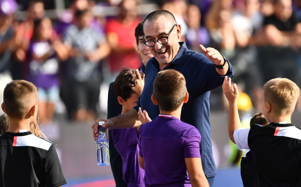 Juventus' Italian coach Maurizio Sarri greets boys at the end of the Italian Serie A football match Fiorentina vs Juventus on September 14, 2019 at the Artemio-Franchi stadium in Florence. / AFP / Vincenzo PINTO