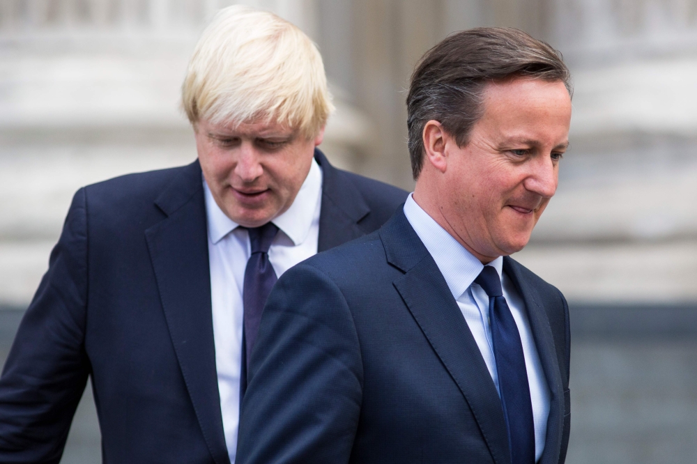 David Cameron and Boris Johnson leave St Paul's Cathedral in central London after attending a memorial service in memory of the 52 victims of the 7/7 London attacks on July 07, 2015. AFP / Jack Taylor 