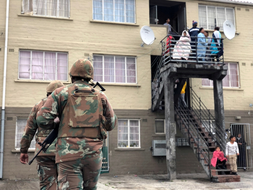 Soldiers patrol against gang violence in Manenberg township, Cape Town, South Africa, July 18, 2019. Reuters/Shafiek Tassiem