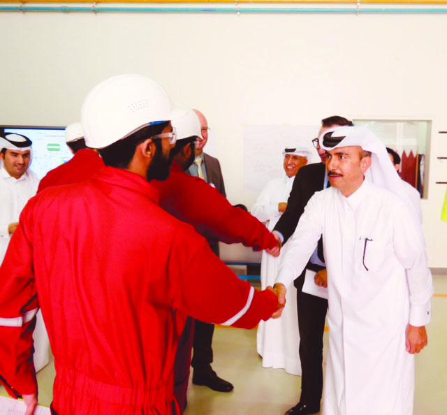 Officials from Qatar Shell meet with sponsored students during a recent visit to CNA-Q.