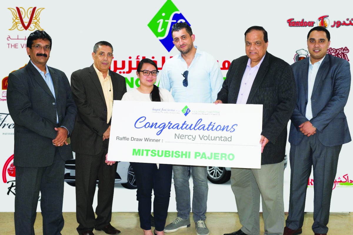 Officials with the winner of Mitsubishi Pajero. 