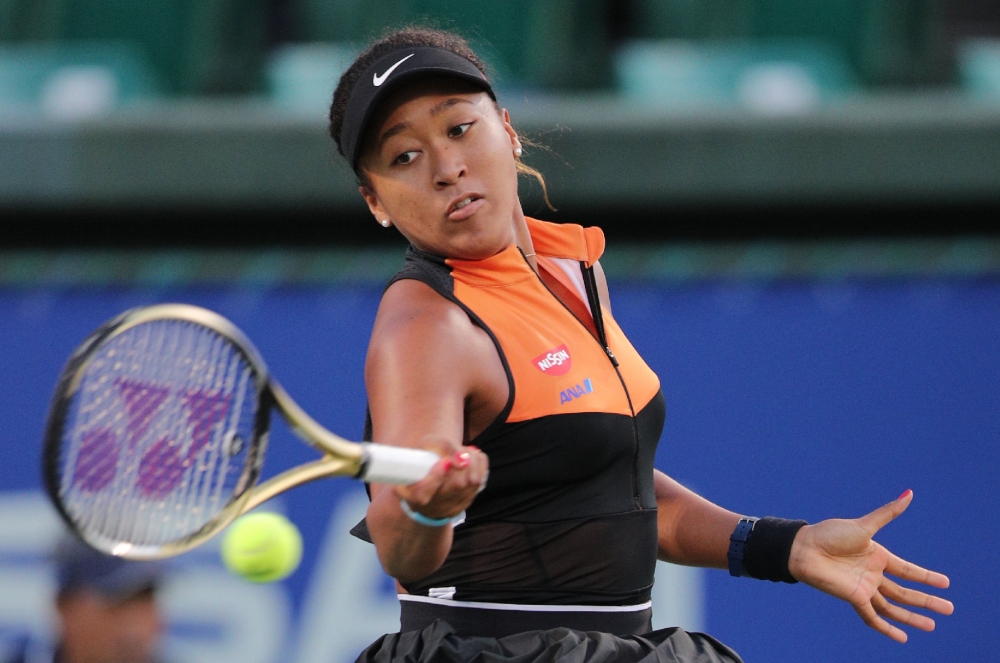 Japan's Naomi Osaka hits a return against Bulgaria's Viktoriya Tomova in women's singles round of 16 at the Pan Pacific Open tennis tournament in Osaka on September 18, 2019. Japan OUT / AFP / JIJI PRESS / Jiji Press