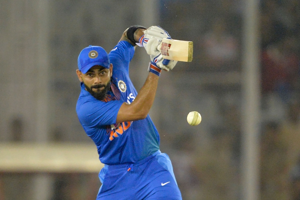 Indian captain Virat Kohli plays a shot during the second Twenty20 international cricket match of a three-match series between India and South Africa at Punjab Cricket Association Stadium in Mohali on September 18, 2019. (AFP / Sajjad HUSSAIN)