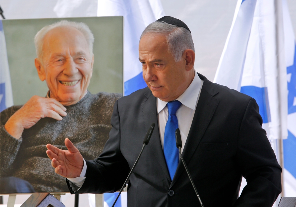 Benjamin Netanyahu delivers a speech during a memorial ceremony for late Israeli president Shimon Peres, at Mount Herzl in Jerusalem, on September 19, 2019. AFP / Gil Cohen-Magen
 