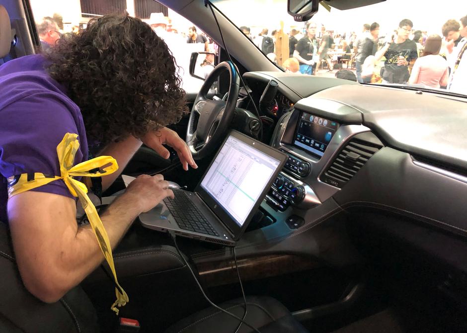 An attendee of the 2019 DEF CON cybersecurity event is seen at the conference's car hacking village in Las Vegas, Nevada, US, August 9, 2019. Reuters/Tina Bellon
