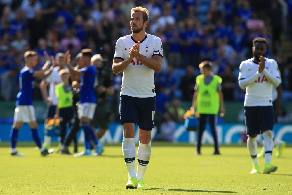 Tottenham Hotspur's English striker Harry Kane (C) and Tottenham Hotspur's English defender Danny Rose (R) applauds the fans following the English Premier League football match between Leicester City and Tottenham Hotspur at King Power Stadium in Leiceste
