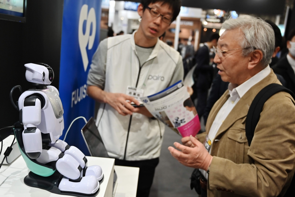 This photo taken on April 5, 2019 shows Palro, a robot developed by the Fujisoft company, on display during the Artificial Intelligence expo in Tokyo. AFP / CHARLY TRIBALLEAU /
