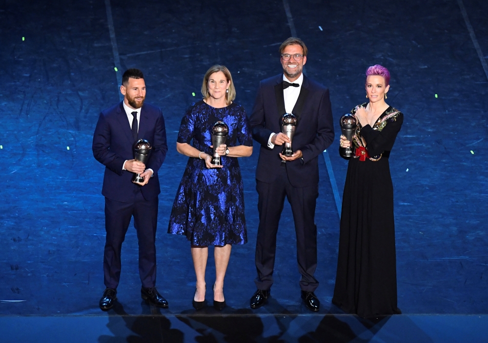 FC Barcelona's Lionel Messi poses after winning the Best FIFA Men's player award with the winner of the Best FIFA Men's coach award Liverpool manager Juergen Klopp, winner of the Best FIFA Women's player award USA women's Megan Rapinoe and the winner of t