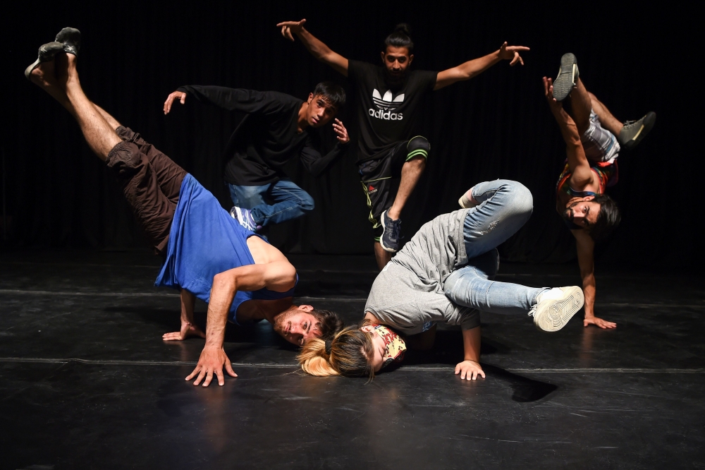 In this photo taken on August 4, 2019, Afghan breakdancers pose for a photograph at the French Cultural Centre in Kabul. AFP / WAKIL KOHSAR 