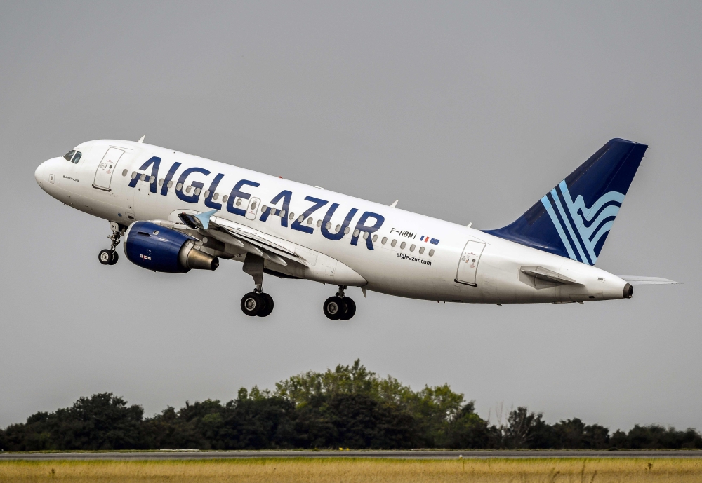 FILE PHOTO: An Airbus A319 aircraft belonging to the Weaving group's French airline Aigle Azur taking off from Lille Airport in Lesquin, northern France.  AFP / PHILIPPE HUGUEN