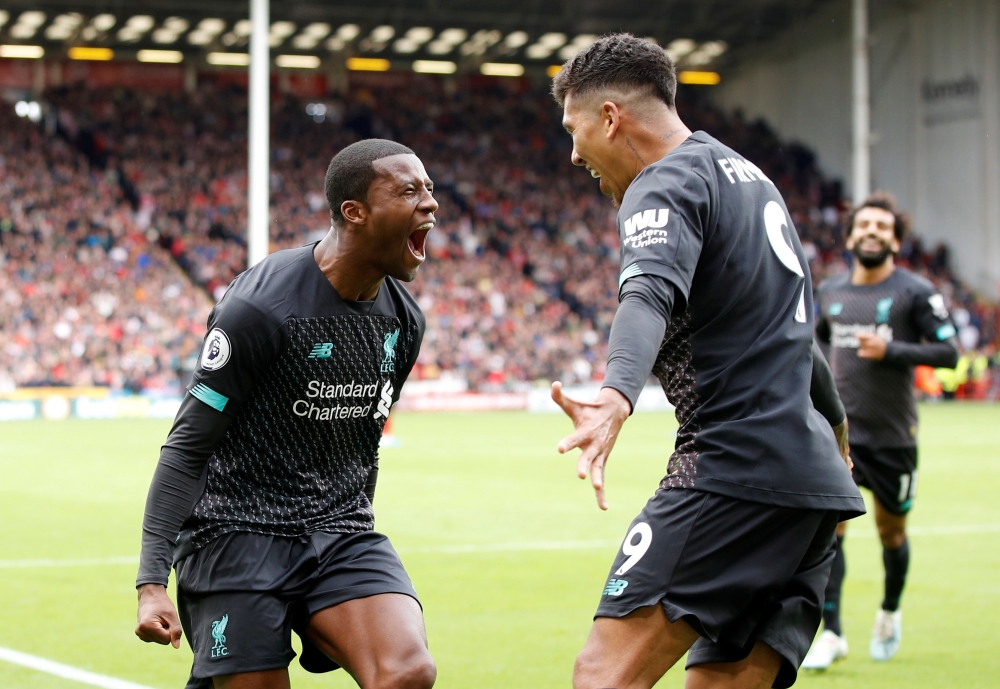  Liverpool's Georginio Wijnaldum celebrates scoring their first goal with Roberto Firmino REUTERS/Phil Noble 