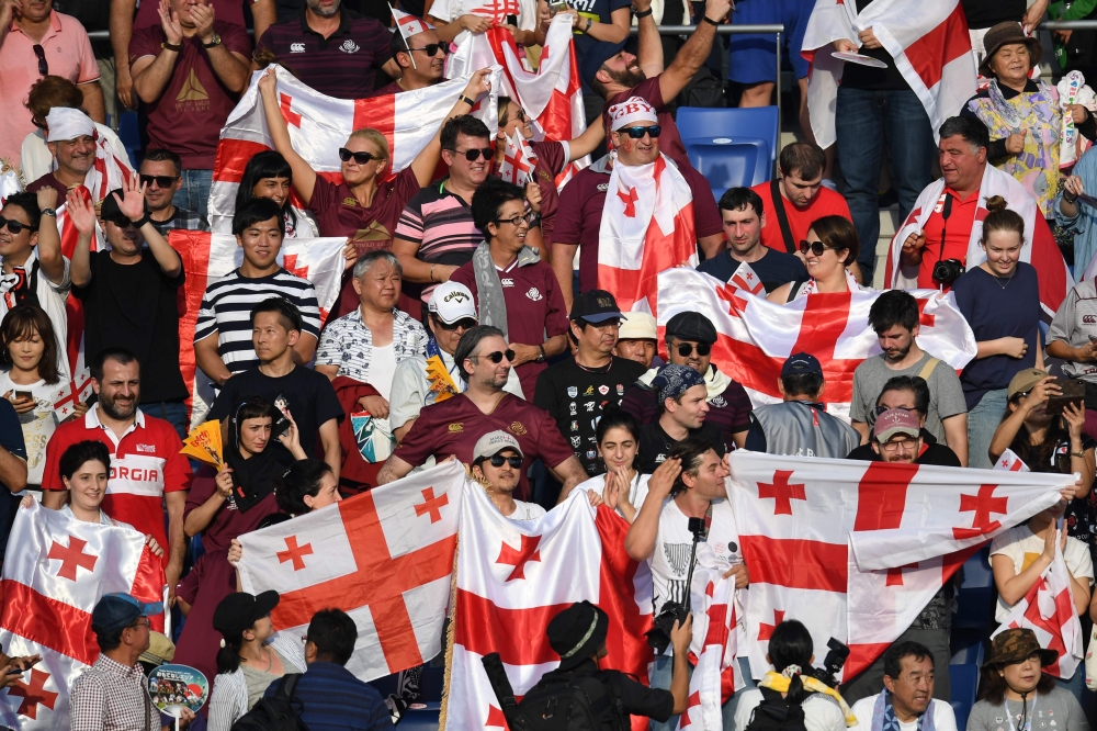 Georgia supporters celebrate their team winning the Japan 2019 Rugby World Cup Pool D match between Georgia and Uruguay at the Kumagaya Rugby Stadium in Kumagaya on September 29, 2019. AFP / CHARLY TRIBALLEAU